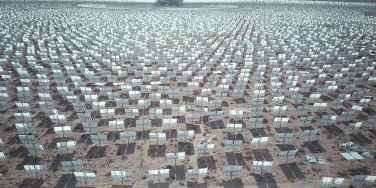 Aerial view of expansive solar panel array in a desert landscape generating renewable energy. Renewable Energy: Clean Power for Our Future