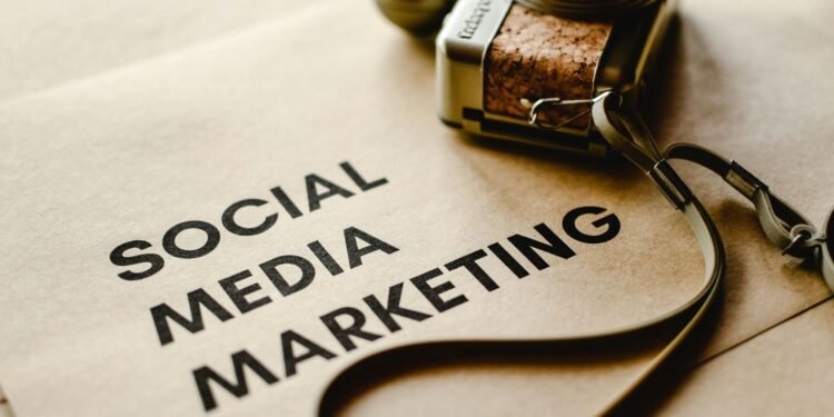 Close-up of a camera placed on brown paper with 'Social Media Marketing' text, emphasizing digital marketing themes. best social media management tools